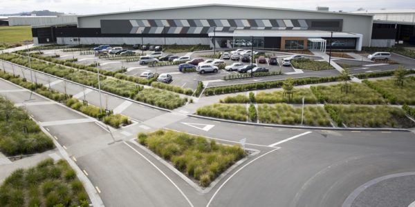 Completed warehouse and distribution facility with sealed carpark, landscaping and access roads