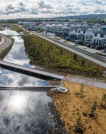 Stormwater corridor and pedestrian bridge through a new residential development